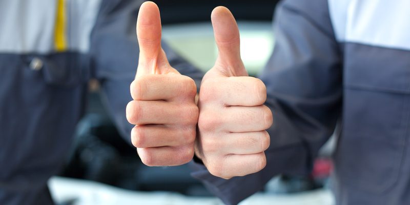 two car mechanic hands thumbs up